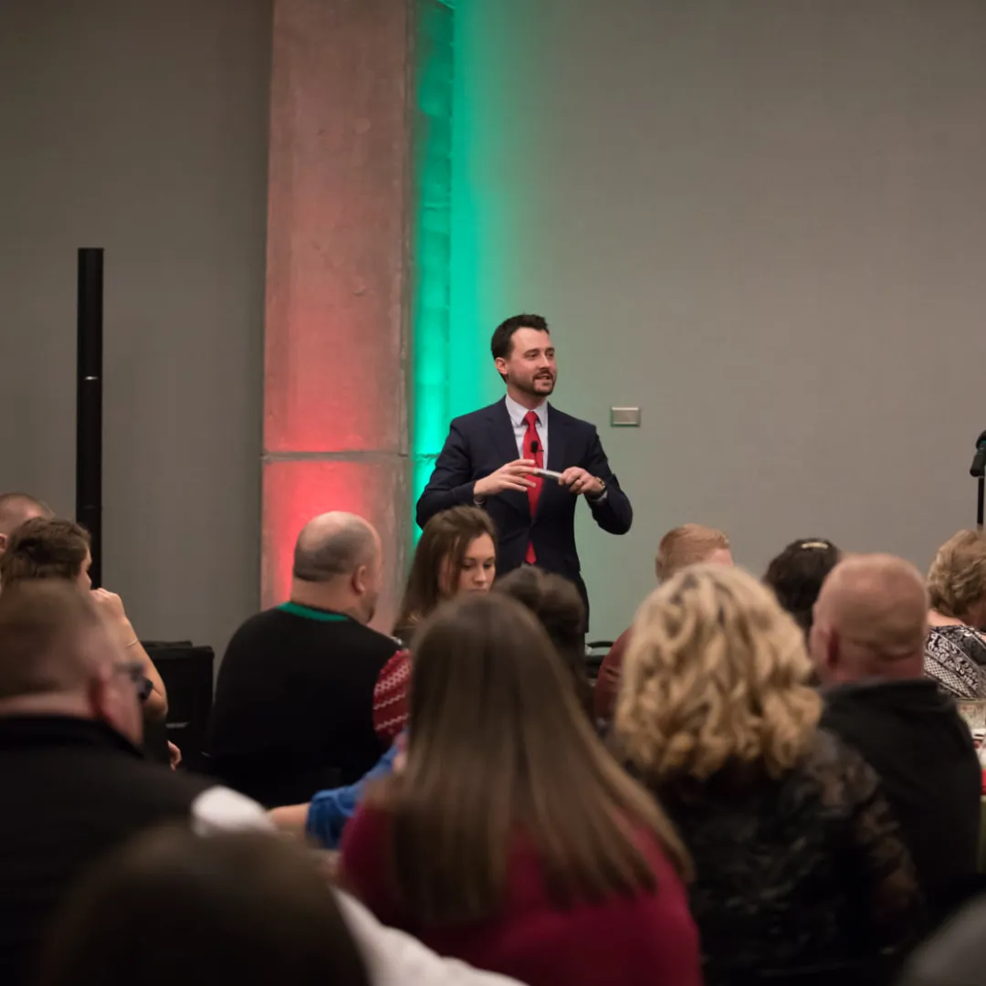 Josh Fletcher speaking to an audience at an event